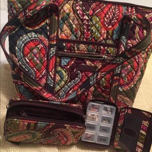3 different Vera Bradley bags and wallets